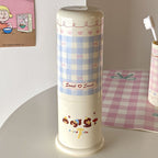 1Stylish toothbrush holder with playful checkered pattern Miroken