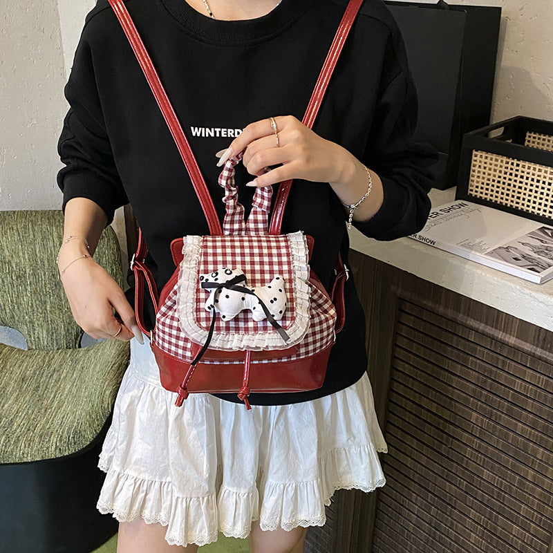 1Playful backpack with checkered pattern and animal appliqué Miroken