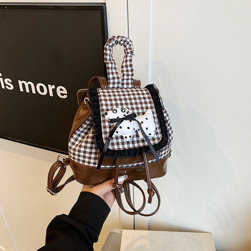 1Playful backpack with checkered pattern and animal appliqué Miroken