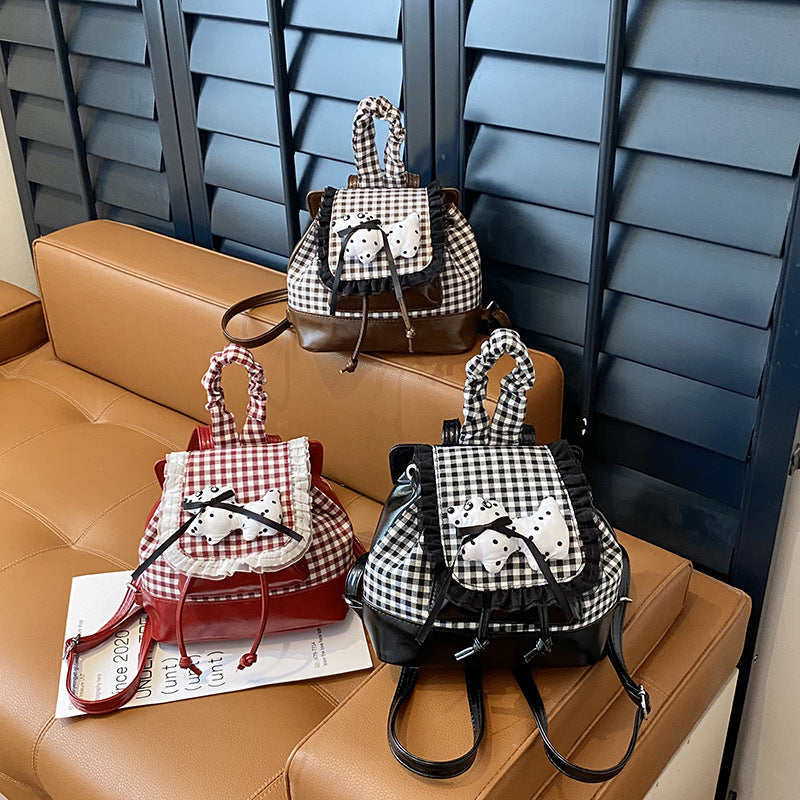 1Playful backpack with checkered pattern and animal appliqué Miroken