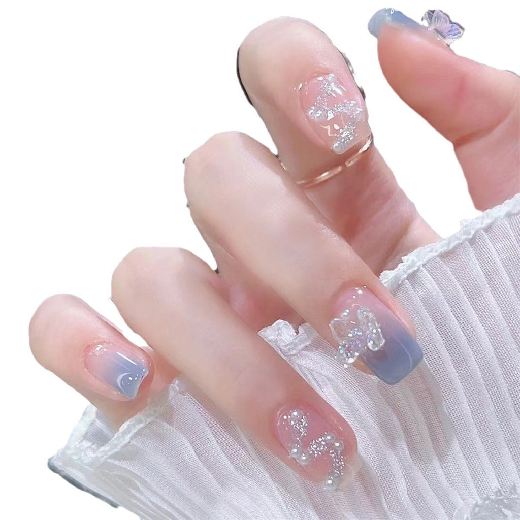 1Artistic nail decoration with glitter and butterfly details Miroken
