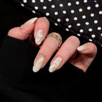 1Artificial nails with shimmering accents and elegant applications Miroken