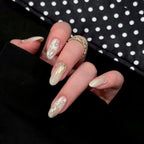 1Artificial nails with shimmering accents and elegant applications Miroken