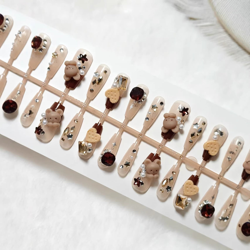 1Creative acrylic nails with animal motifs and glitter accents Miroken