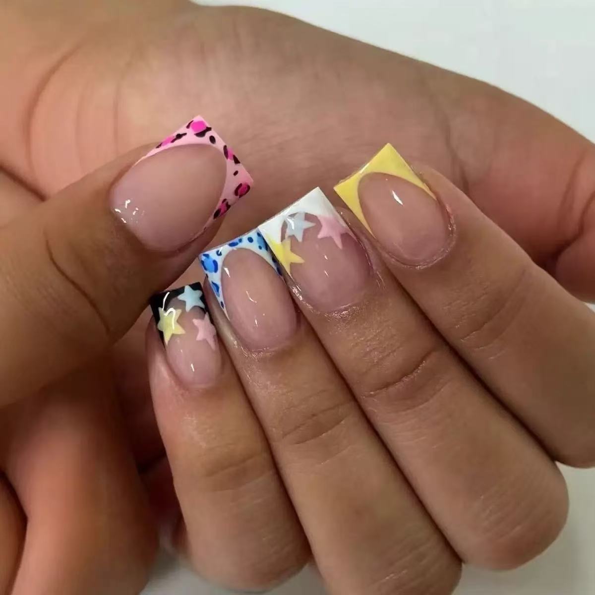 1Acrylic nail set with colorful star motifs and modern accents Miroken