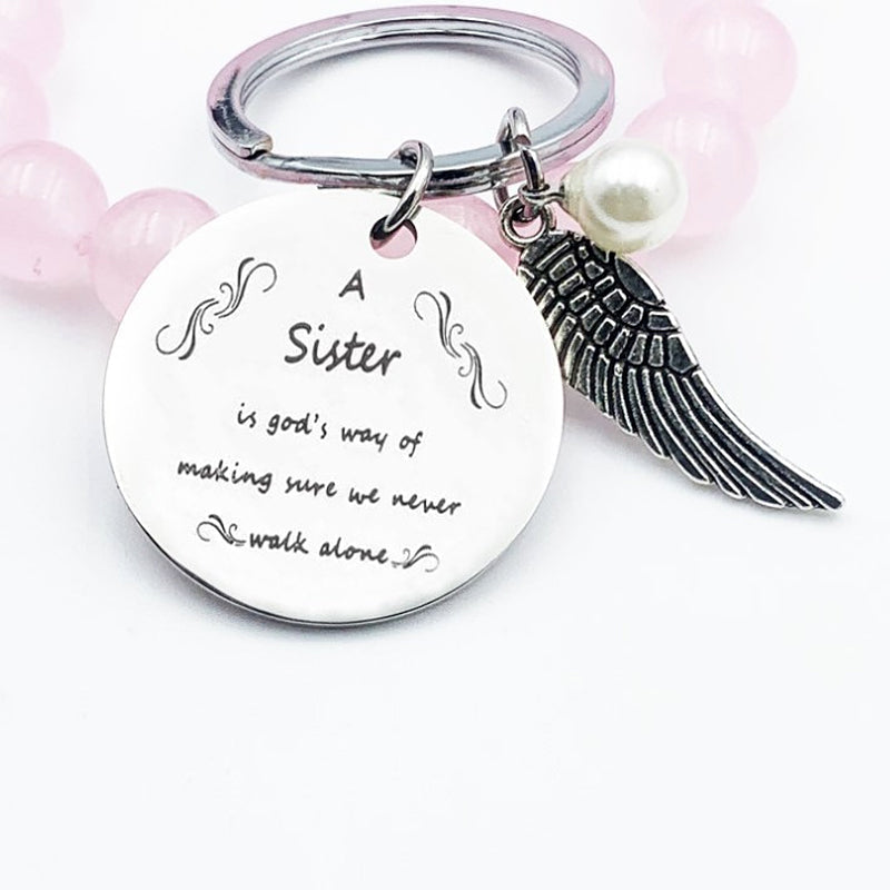 A sister is God's way of making sure we never walk alone keychain